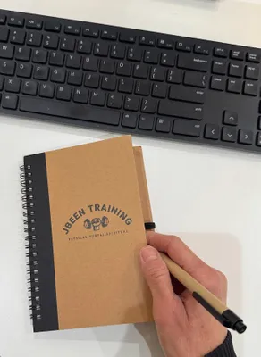 Creating goals for 2025 with my new branded note pad from Custom Beanies Now