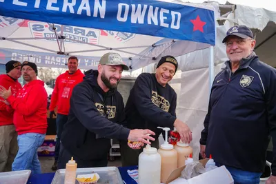 Gildan Adult Heavy Blend 8 oz., 50/50 Hooded Sweatshirt - Arbos Cheese Dip sponsored a veteran non-profit Travis Manion Foundation serving Arbos Cheese Dip and Corkys BBQ nachos to thousands of tailgate attendees at the Army Navy Game in Baltimore MD Dec 13th 2025 The slick beanies and hoodies kept us warm and promoted our brand perfectly