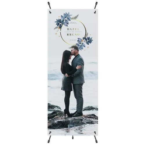 A vertical banner displays a couple embracing on a rocky shore, with floral and geometric designs surrounding text that reads 'Hazel & Bruno' for a presumably romantic event.